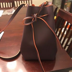 LEATHER EGGPLANT AND ORANGE BUCKET CROSSBODY